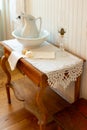 19th Century wood washing table with water bowl and jug, oil lamp and soap