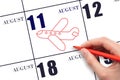 A hand drawing outline of airplane on calendar date 11 August. The date of flight on plane.