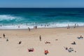 People enjoying hot sunny summer day on Bronte beach and swimming in the sea in Sydney NSW Australia Royalty Free Stock Photo