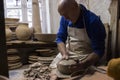 Hands of ceramic artist making a piece