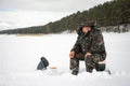 24th of Feb 2020, Russia, Tomsk, fisher on the frozen river