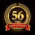 56th golden anniversary logo, with shiny ring and red ribbon, laurel wreath isolated on black background, vector design Royalty Free Stock Photo