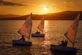 30th International Vila de PalamÃÂ³s Optimist Trophy, 14th Nations Cup. Sailboats sailing to the harbor small town Palamos in