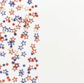 4th of July American Independence Day blue and red stars decorations on white background. Royalty Free Stock Photo