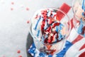 4th of July American Independence Day food or drink. Crazy milkshake with strawberry and vanilla ice cream white, blue, red colors Royalty Free Stock Photo