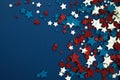 4th of July American Independence Day stars decorations on blue background. Flat lay, top view. Royalty Free Stock Photo