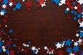 4th of July American Independence Day stars decorations on wooden background. Flat lay, top view. Royalty Free Stock Photo