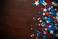 4th of July American Independence Day stars decorations on wooden background. Flat lay, top view. Royalty Free Stock Photo