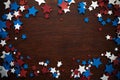 4th of July American Independence Day stars decorations on wooden background. Flat lay, top view.