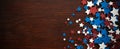 4th of July American Independence Day stars decorations on wooden background. Flat lay, top view. Royalty Free Stock Photo