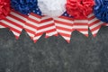 4th of July background. USA paper fans, Red, blue, white stars, balloons, gold confetti on gray dark concrete background. Happy Royalty Free Stock Photo