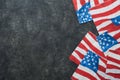 4th of July background. USA paper fans, Red, blue, white stars, balloons, gold confetti on gray dark concrete background. Happy Royalty Free Stock Photo