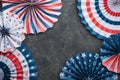 4th of July background. USA paper fans, Red, blue, white stars, balloons, gold confetti on gray dark concrete background. Happy Royalty Free Stock Photo