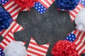 4th of July background. USA paper fans, Red, blue, white stars, balloons, gold confetti on gray dark concrete background. Happy Royalty Free Stock Photo