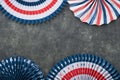 4th of July background. USA paper fans, Red, blue, white stars, balloons, gold confetti on gray dark concrete background. Happy Royalty Free Stock Photo