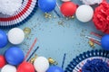 4th of July background. USA paper fans, Red, blue, white stars, balloons and gold confetti on blue wall background. Happy Labor Royalty Free Stock Photo