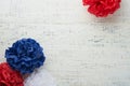 4th of July background. USA paper fans, Red, blue, white stars, balloons, gold confetti on white wooden background. Happy Labor Royalty Free Stock Photo