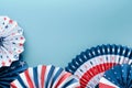 4th of July background. USA paper fans, Red, blue, white stars and confetti on blue wall background. Happy Labor Day, Independence Royalty Free Stock Photo