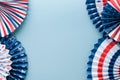 4th of July background. USA paper fans, Red, blue, white stars and confetti on blue wall background. Happy Labor Day, Independence Royalty Free Stock Photo