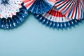 4th of July background. USA paper fans, Red, blue, white stars and confetti on blue wall background. Happy Labor Day, Independence Royalty Free Stock Photo