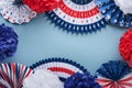 4th of July background. USA paper fans, Red, blue, white stars and confetti on blue wall background. Happy Labor Day, Independence Royalty Free Stock Photo