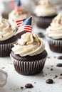 4th of july chocolate cupcakes with cream cheese and eeuu flag on top on wooden table