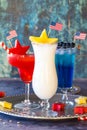 4th of July cocktails with fresh fruit and patriotic flag garnishments.