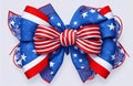 4th July emblem with a blue stars bow and curly red and white ribbon to celebrate the independence of the united states of america