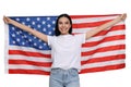 4th of July - Independence day of America. Happy woman holding national flag of United States on white background Royalty Free Stock Photo