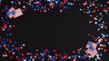 4th of July Independence day celebration background. Frame made of blue, red and white confetti stars and American flags on dark Royalty Free Stock Photo