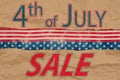 4th of July Sale type message with retro USA stars and stripes burlap ribbon Royalty Free Stock Photo