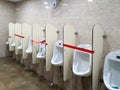 6th June 2020- Bagdogra Airport,Siliguri, West Bengal,India - Adjacent urinals blocked to maintain social distancing at Bagdogra Royalty Free Stock Photo