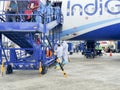 6th June 2020- Bagdogra Airport,Siliguri, West Bengal, India-Indigo airlines Cabin crew getting dressed in white protective gear Royalty Free Stock Photo