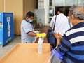 6th June 2020- Bagdogra Airport,Siliguri, West Bengal, India-Passengers in protective gear being sanitized on arrival by airport Royalty Free Stock Photo