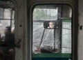 10th of June 2018, Russia, Tomsk, a portait of tram driver in a back view mirrow