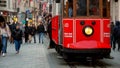 15th of March, 2023, Turkey, Istanbul. People riding of famous red train on Istiklal street