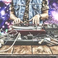 9th of March. World Day DJ. DJ playing music at mixer closeup. DJ at the remote in a nightclub Royalty Free Stock Photo