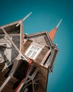 25th of May 2022, Russia, Tomsk, Wooden historical building in Tomsk on the sky background