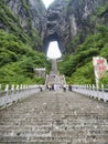 28th of May, 2018: Tourists stepping down the steep 999 stairs at The Tianmen Mountain, The Heaven`s Gate at Zhangjiagie, Hunan P Royalty Free Stock Photo