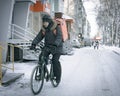 17th November 2021, Russia, Tomsk, bicycle courier on street in winter