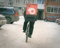 17th November 2021, Russia, Tomsk, bicycle courier on street in winter