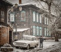 16th of October 2016, Russia, old man cleans his car