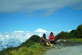 7th October 2022, Zuluk, Sikkim, India. Road Construction Worker taking rest in Silk Route with Kanchenjunga in Background