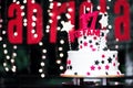 17th party or birthday party cake, sweet seventeenth white cakes with sparkle star decorative and number. dark backgrounds blurred