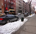 51th Street, near the Intersection with 8th ave, in New York City during winter daytime against a cloudy sky