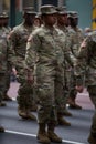 77th U.S. Army Soldiers marching on Fifth Avenue in NYC. US Military Infantry waring camouflage uniforms. Female soldiers in Army
