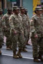77th U.S. Army Soldiers marching on Fifth Avenue in NYC. US Military Infantry waring camouflage uniforms. Female soldiers in Army