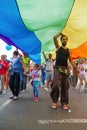 15th Zagreb pride. LGBTIQ activist under big rainbow flag.