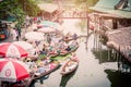 Tha Kha Floating Market, Samut Songkhram, Thailand - November 10, 2017 : The atmosphere of trading goods and food, on vintage boat