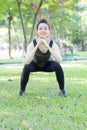 Thai adult beautiful girl doing yoga exercises in the park Royalty Free Stock Photo